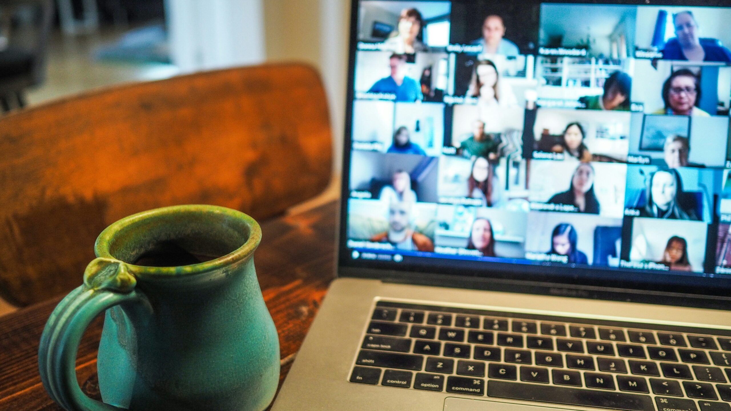 latop online meeting green mug wooden chair